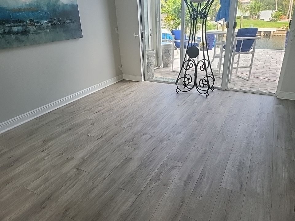Restored waterfront living room with clean floors after water damage restoration